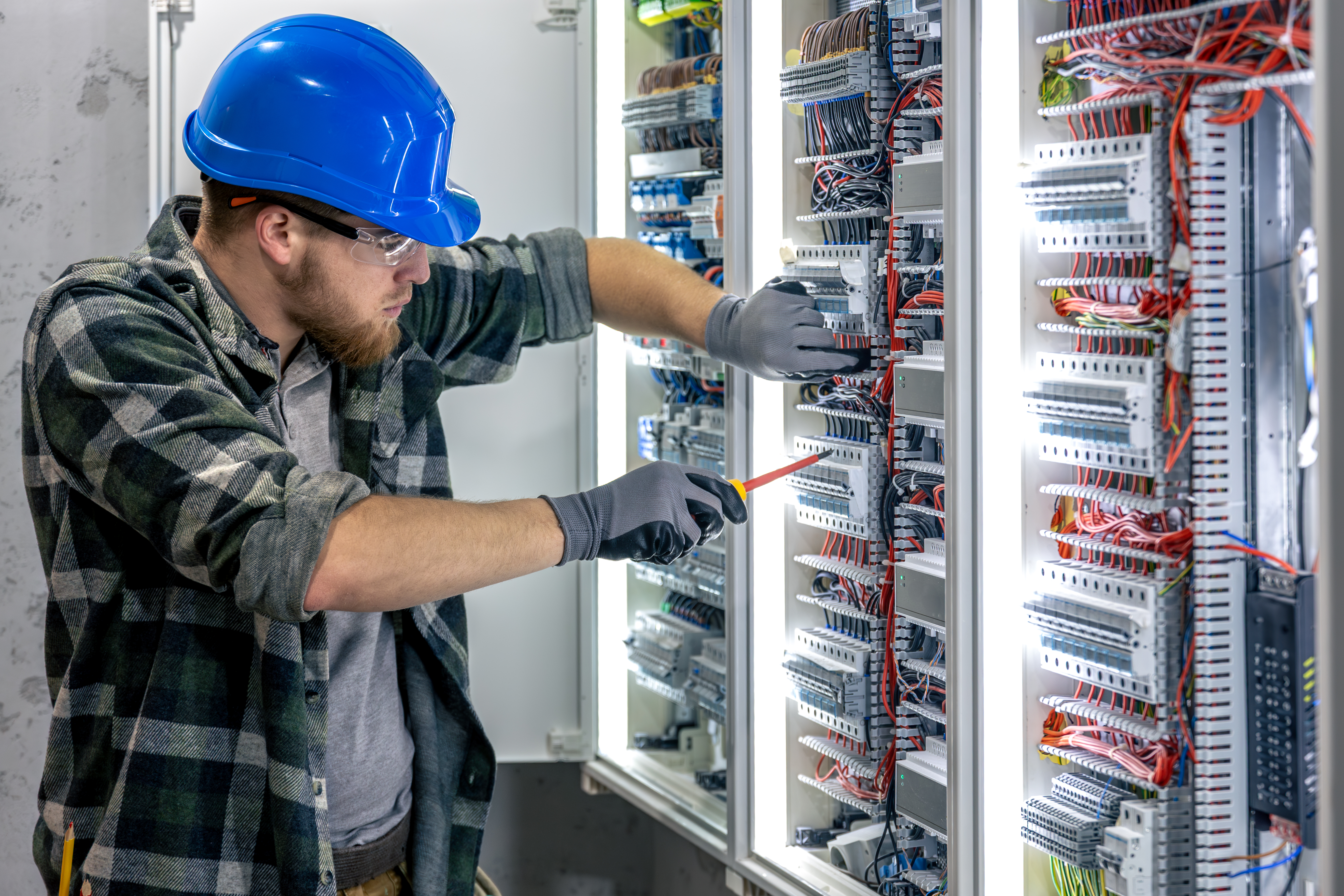 Electrician wiring a consumer unit